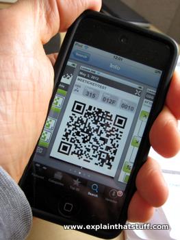 A mobile boarding pass displayed on the screen of an iPhone.