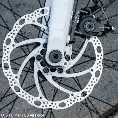 A closeup of a Tektro bicyce brake disk