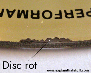 Close-up of compact disc rot on the edge of the disc