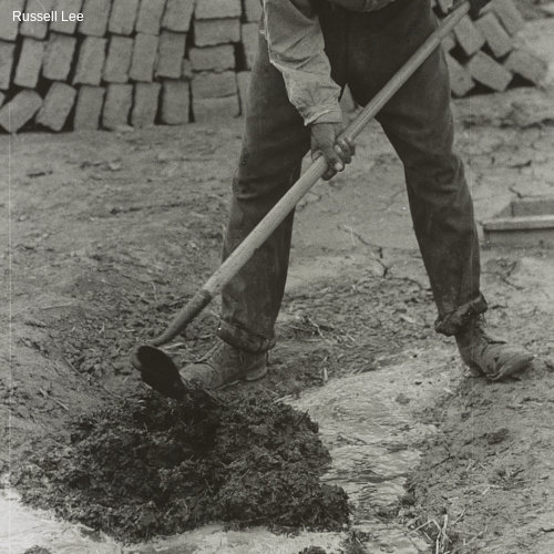 Dirt, straw and water are mixed to form the adobe mixture for bricks, Chamisal, New Mexicos
