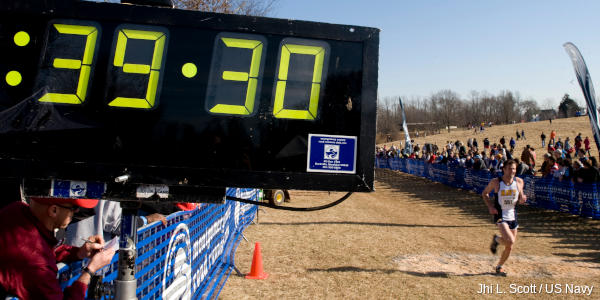 A large digital clock timing runners in a race.