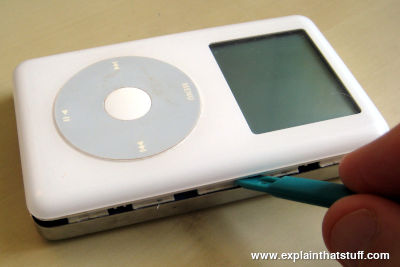 Opening up an iPod with a special plastic tool