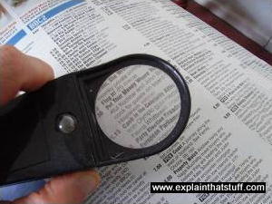 Magnifying glass and newspaper