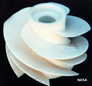 A typical white plastic impeller from inside a pump.